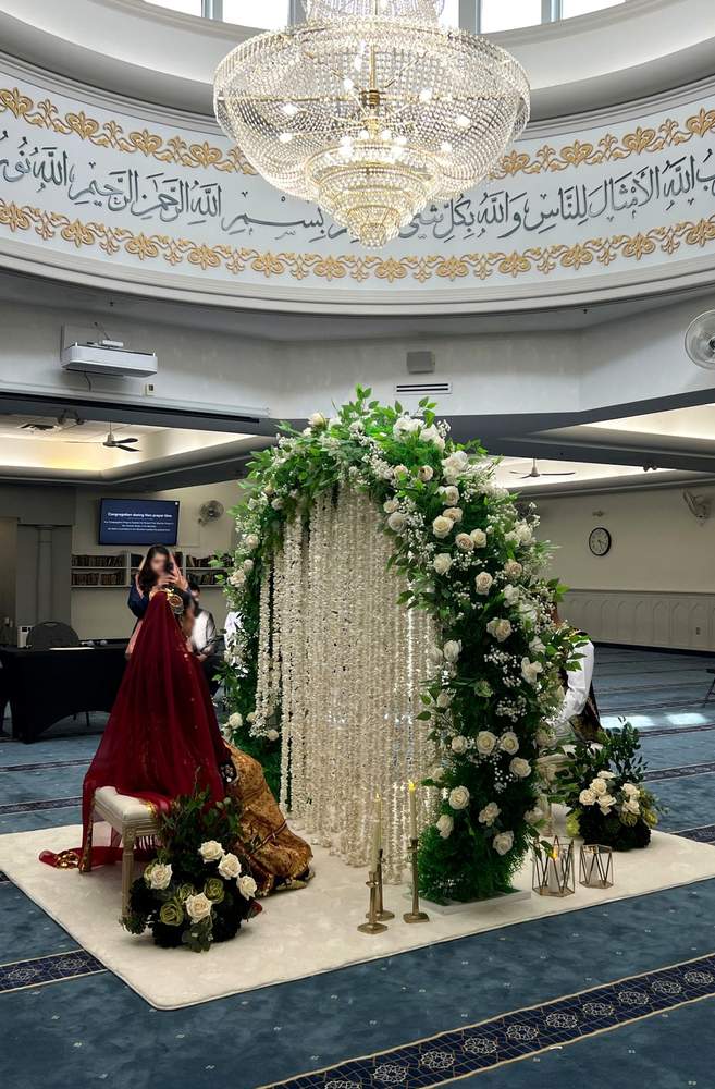 Red floral ceremony setup